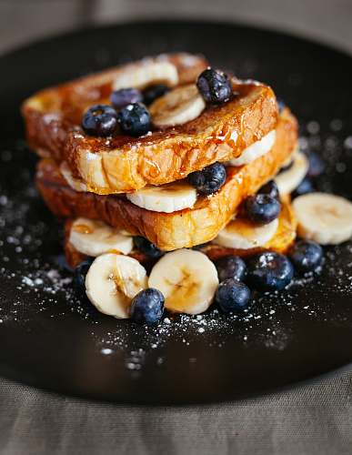 french toast toast bread with blueberry on black plate blueberry